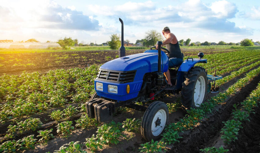 Farmers were refinanced through external loans and, to a lesser extent, grants a farmer on a tractor