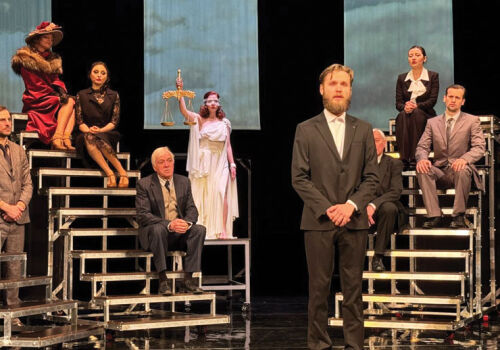 In the theater named after Chekhov. Chekhov’s theater has “The Trial”