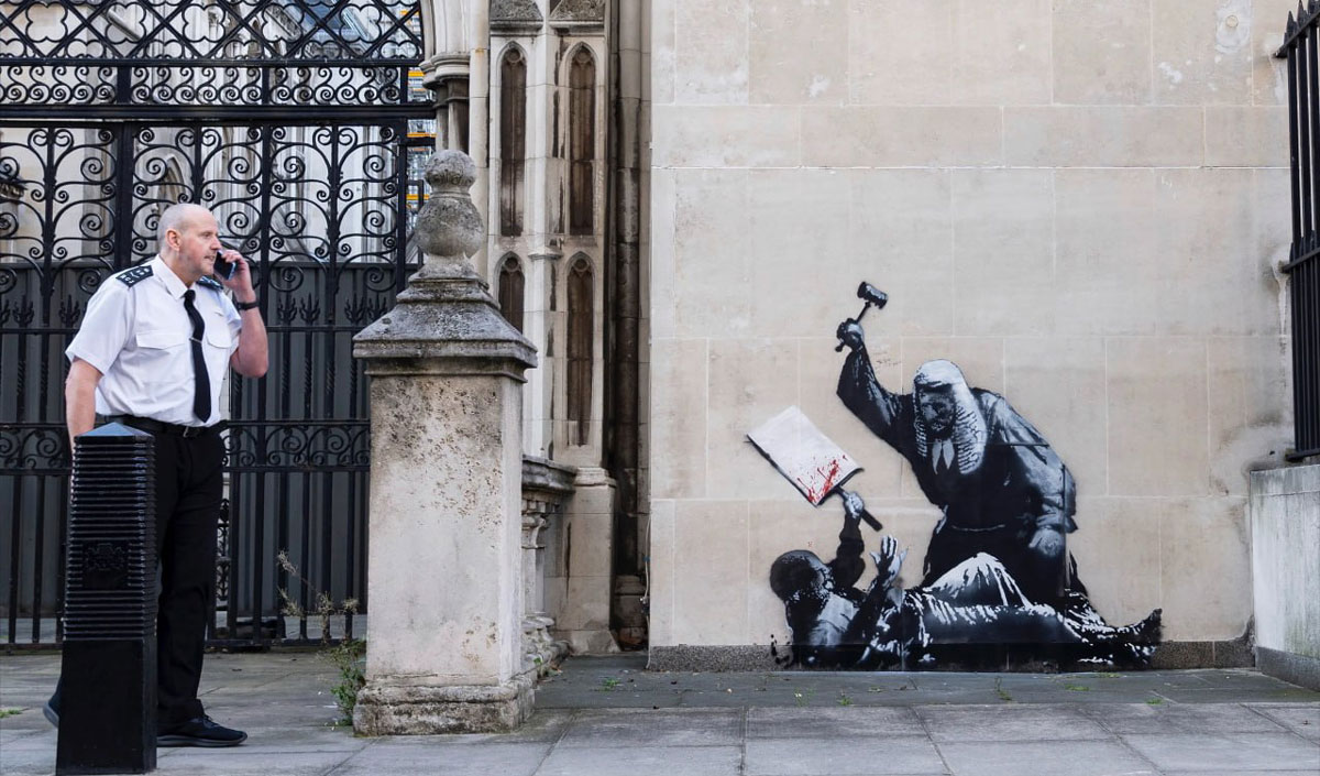 Banksy paints—the British pay