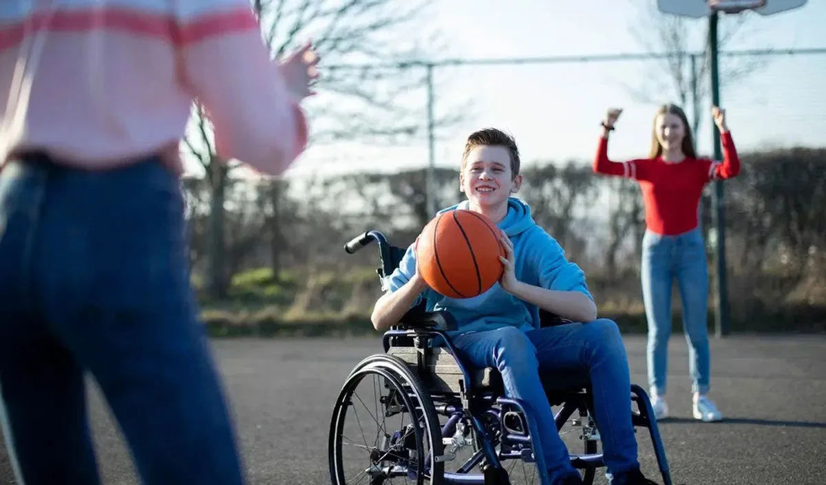 a boy in a wheelchair